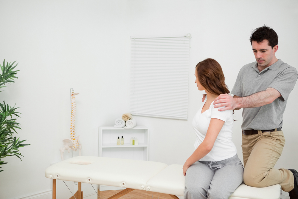 patient getting chiropractic treatment for pinched nerves